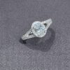 Oval diamond halo ring with split band in 18K white gold – Geretti Jewellery