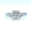 Radiant cut diamond engagement ring with two pear-shaped side diamonds set in white gold