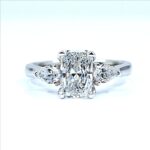 Radiant cut diamond engagement ring with two pear-shaped side diamonds set in white gold