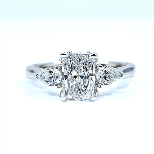 Radiant cut diamond engagement ring with two pear-shaped side diamonds set in white gold