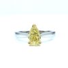 Natural fancy yellow pear-shaped diamond set on a minimalist white gold band, custom made by Geretti Jewellery Sablon