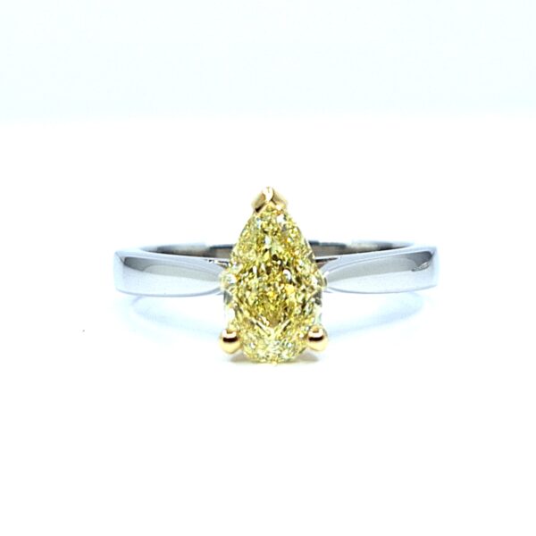 Natural fancy yellow pear-shaped diamond set on a minimalist white gold band, custom made by Geretti Jewellery Sablon